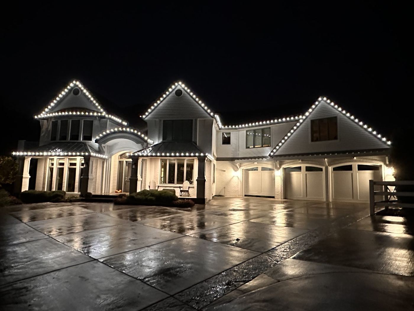 Large home with every roofline outlined in warm white C9 lights