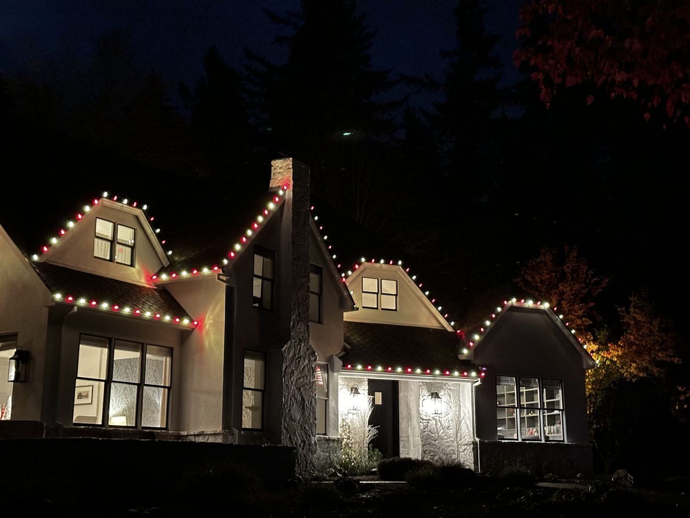Red and white roofline lights under the moon